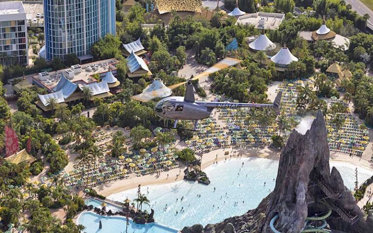 aerial view of helicopter flying over volcano bay universal at maxflight helicopter services kissimmee