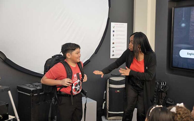 boy learning about film process at jesus film project tour