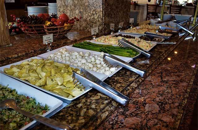 buffet table with artichoke mozzarella asparagus gourmet boi brazil orlando