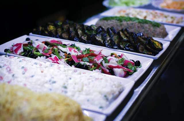 buffet trays of roasted portobello and other sides at cafe mineiro brazilian steakhouse orlando