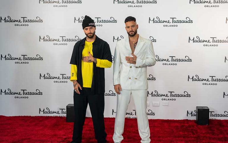 celebrity maluma standing beside wax replica on red carpet at madame tussauds orlando at icon park
