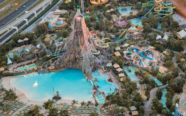 daytime view from above of volcano bay water park at maxflight helicopter services