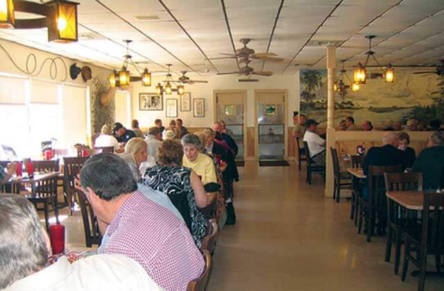 dining area tables with customers at the catfish place kissimmee