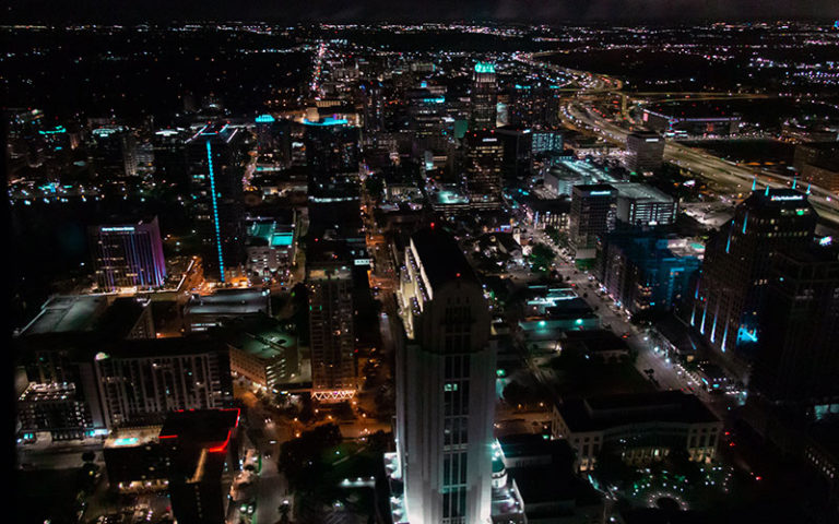 downtown orlando from above view at night with lit up buildings at maxflight helicopter services