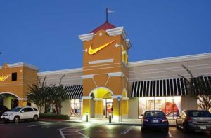 exterior at night of storefront nike sign at lake buena vista factory stores orlando