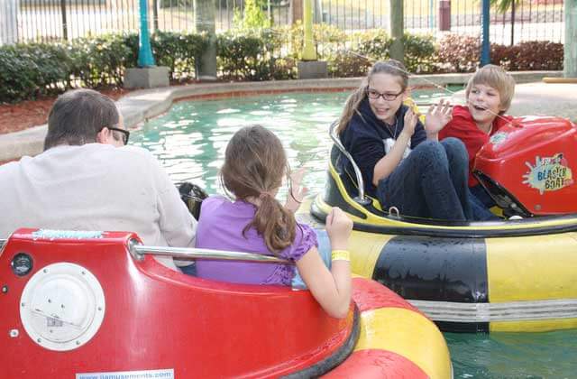 family competing in bumper boats magical midway orlando