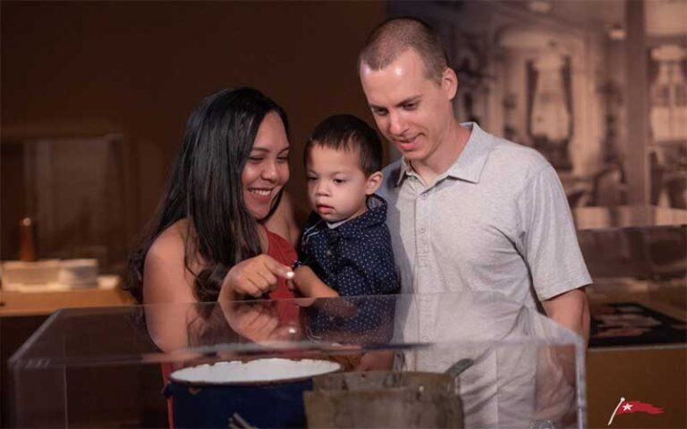 family looking at displays at titanic the artifact exhibition orlando