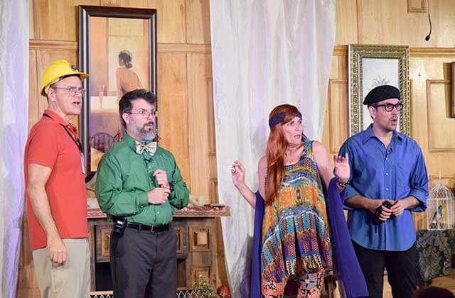 four costumed characters looking shocked mid performance at sleuths mystery dinner shows orlando