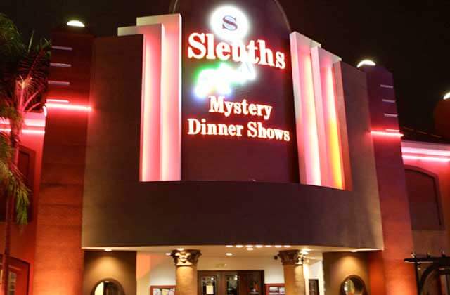 front exterior lit up sign night sleuths mystery dinner show orlando