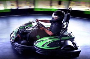 go karter speeding along track at andretti indoor karting games orlando