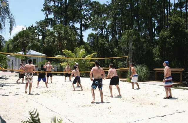 group playing beach volleyball at buena vista watersports orlando