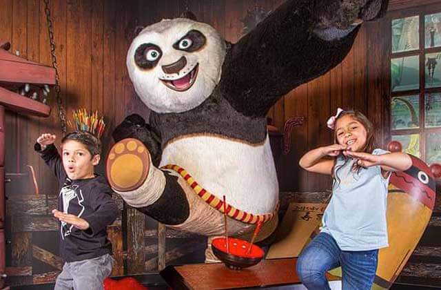 kids pose with kung fu panda wax figure madame tussauds orlando