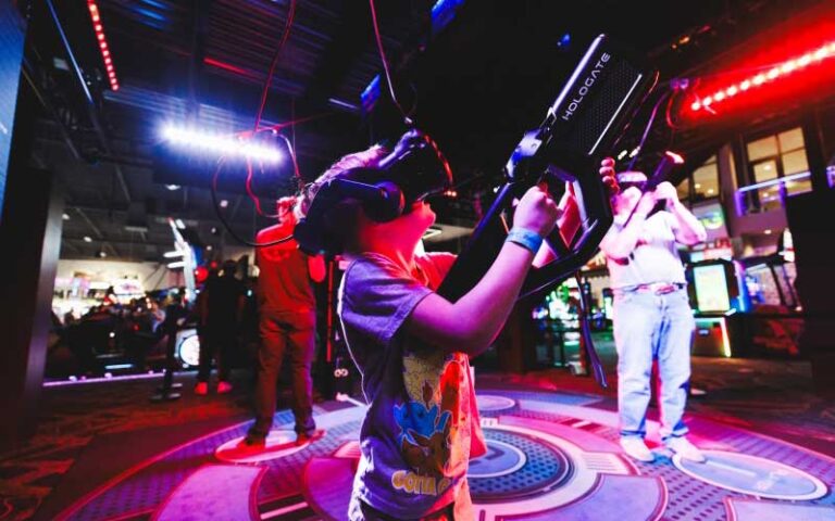 kids with vr headsets and sci fi guns playing at andretti indoor karting games orlando