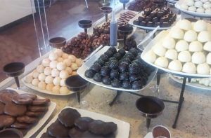large selection of truffles in glass case at chocolate kingdom factory adventure tour orlando