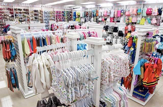 multiple racks of apparel for baby and toddler at macrobaby store orlando