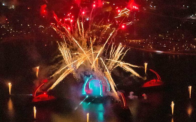 night view from above of fireworks show at epcot at maxflight helicopter services