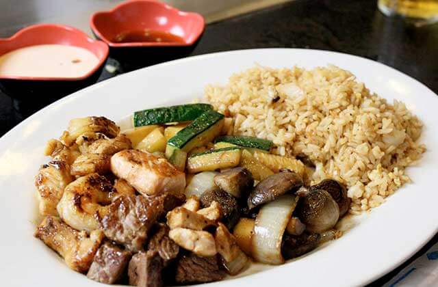 platter with stir fry rice steak chicken and vegetables at shogun japanese steakhouse sakura sushi orlando