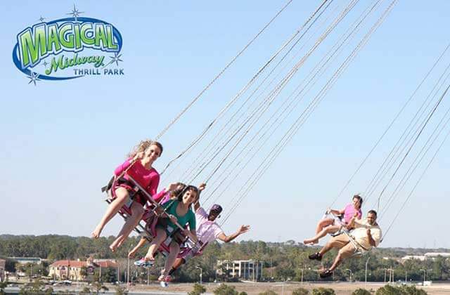 riders on chair swing with aerial view magical midway orlando
