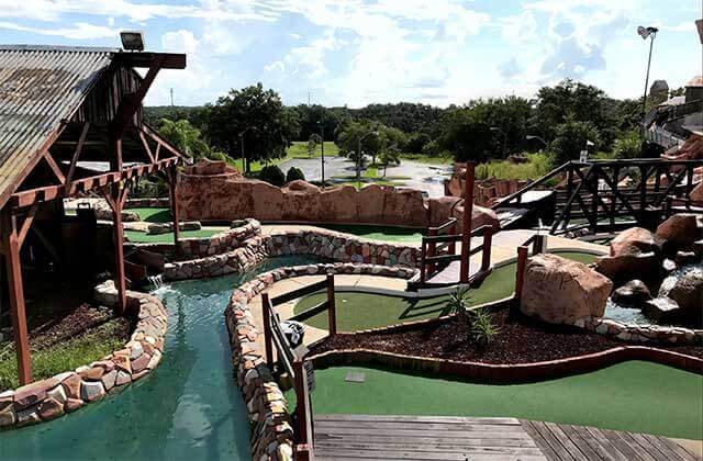 several holes on a putting course with mining theme at bonanza golf gifts kissimmee