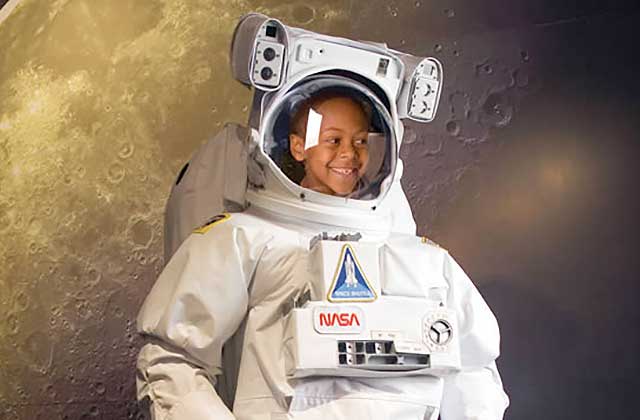 smiling boy astronaut suit wonder works orlando