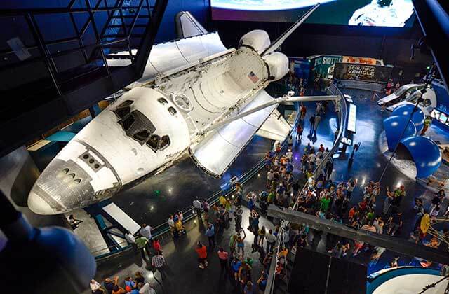 space shuttle atlantis suspended in hangar with crowds kennedy space center visitor complex