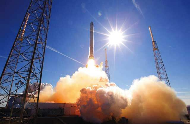 space x falcon rocket launches with smoke at kennedy space center visitor complex