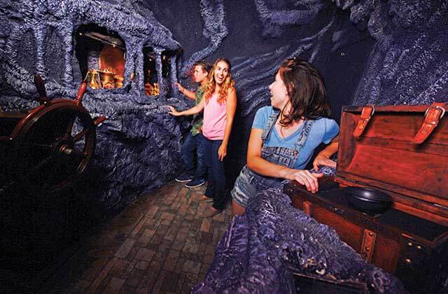 teens searching nautical themed room lockbusters escape game orlando