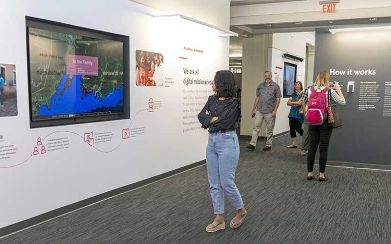 visitors walking through exhibit at jesus film project tour