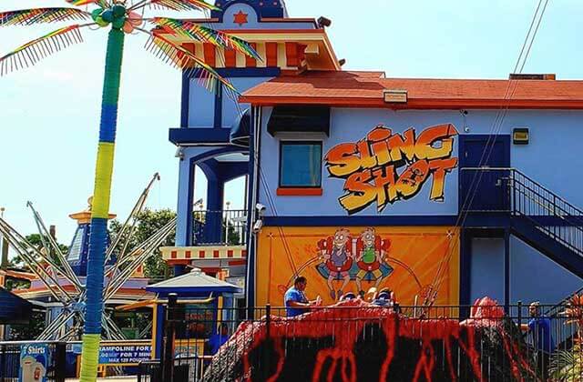 volcano shaped launch area with slingshot sign magical midway slingshot orlando