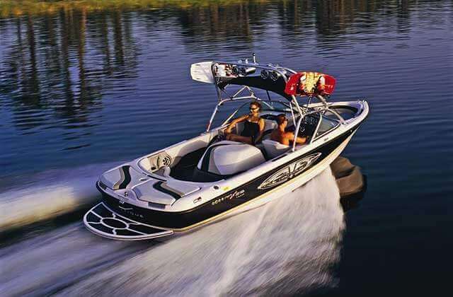 wake boat speeding across water at buena vista watersports orlando