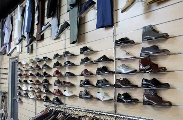 wall rack display with selection of formal dress shoes at orlandos gk menswear store