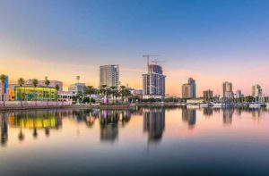 colorful skyline with buildings along bay at twilight at st pete beach destination feature