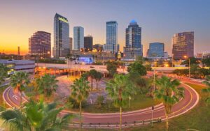 downtown skyline of tampa with sunset and illuminated high rise buildings feature