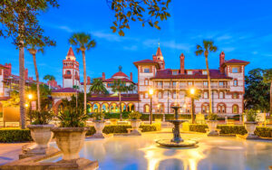 historic buildings at night with fountain and lights flagler college st augustine feature