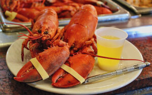 two lobsters with butter sauce at boston lobster feast orlando kissimmee