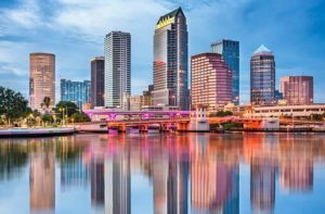 vibrant skyline with buildings with long exposure and reflection in the water at tampa bay destination feature