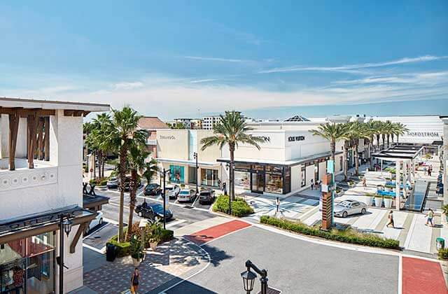 aerial of cross streets with storefronts and palm trees at st johns town center jacksonville
