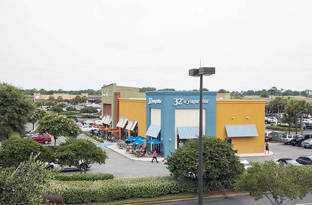 aerial view of outdoor shopping center with blue yellow and red buildings at silver sands premium outlets miramar beach