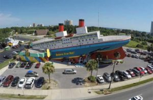 aerial view of building shaped like a sinking ship at ripleys believe it or not panama city beach