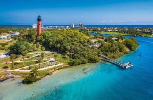 aerial view of a lighthouse grounds with dock inlet trees ocean and hotels at jupiter inlet lighthouse museum florida