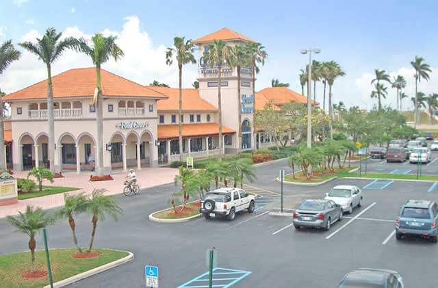 aerial view of shopping center with parking lot and palms at florida keys outlet marketplace