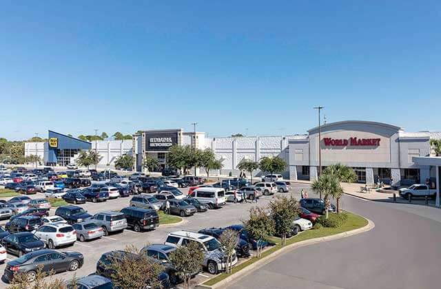 aerial view of storefronts and parking at cordova mall pensacola florida