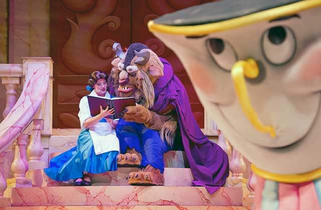 beauty and beast characters performing on stage at disneys hollywood studios theme park orlando
