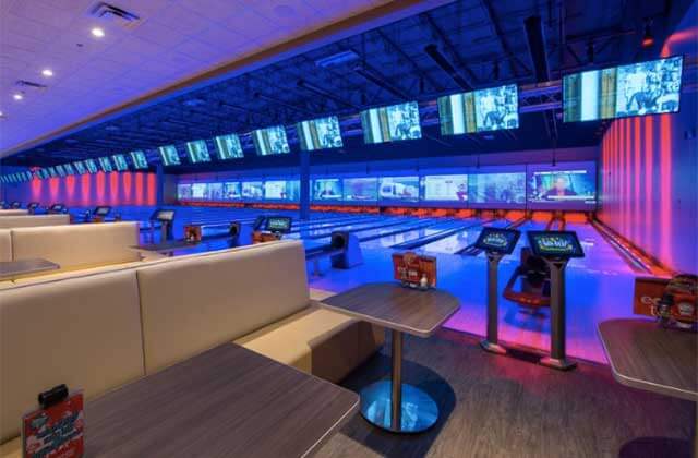 bowling lanes with neon lighting at main event entertainment orlando