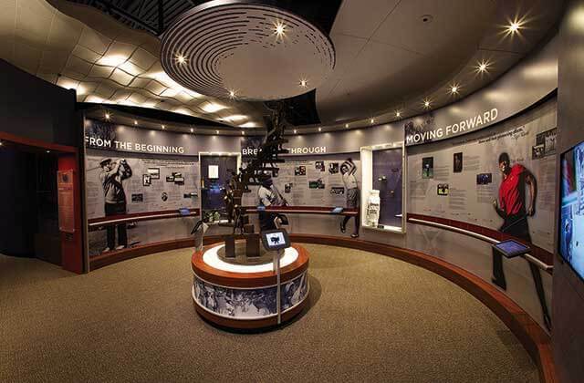 a circular room with exhibits on the history of golf at world golf hall of fame museum st augustine
