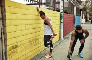 couple of runners on sidewalk and city streets at shoe reebok outlets orlando