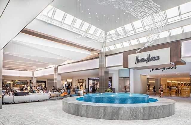 decorative water fountain indoor shopping area with neiman marcus storefront at town center at boca raton florida