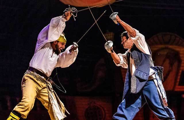 dueling pirate performers spar with swords at pirates dinner adventure orlando