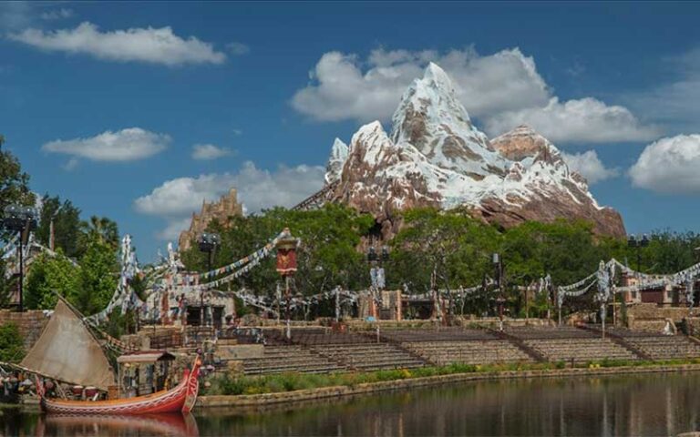 expedition everest ride with park area view from water at disneys animal kingdom walt disney world resort orlando