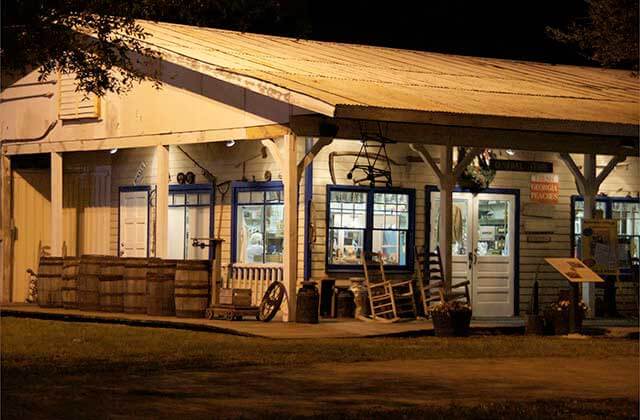 exterior of building with porch and rocking chairs at yesteryear village west palm beach